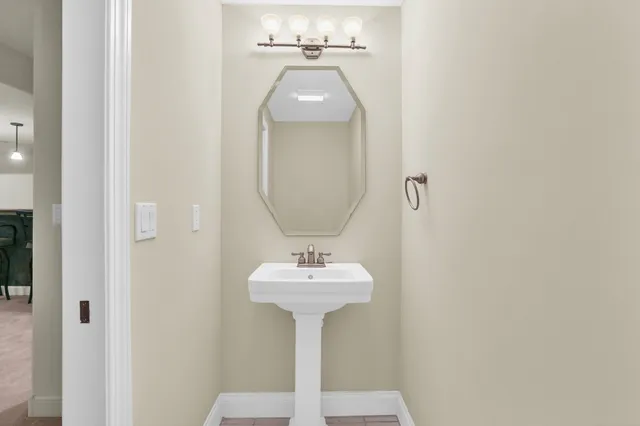 a bathroom with a double vanity sink mirror and