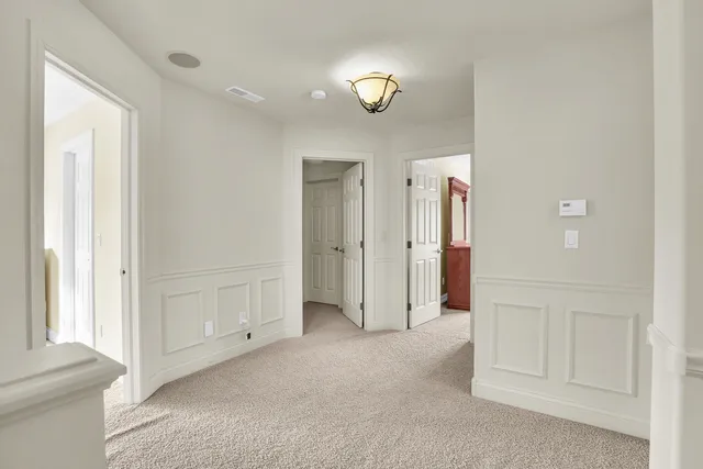 a front view of a house with a dirt yard