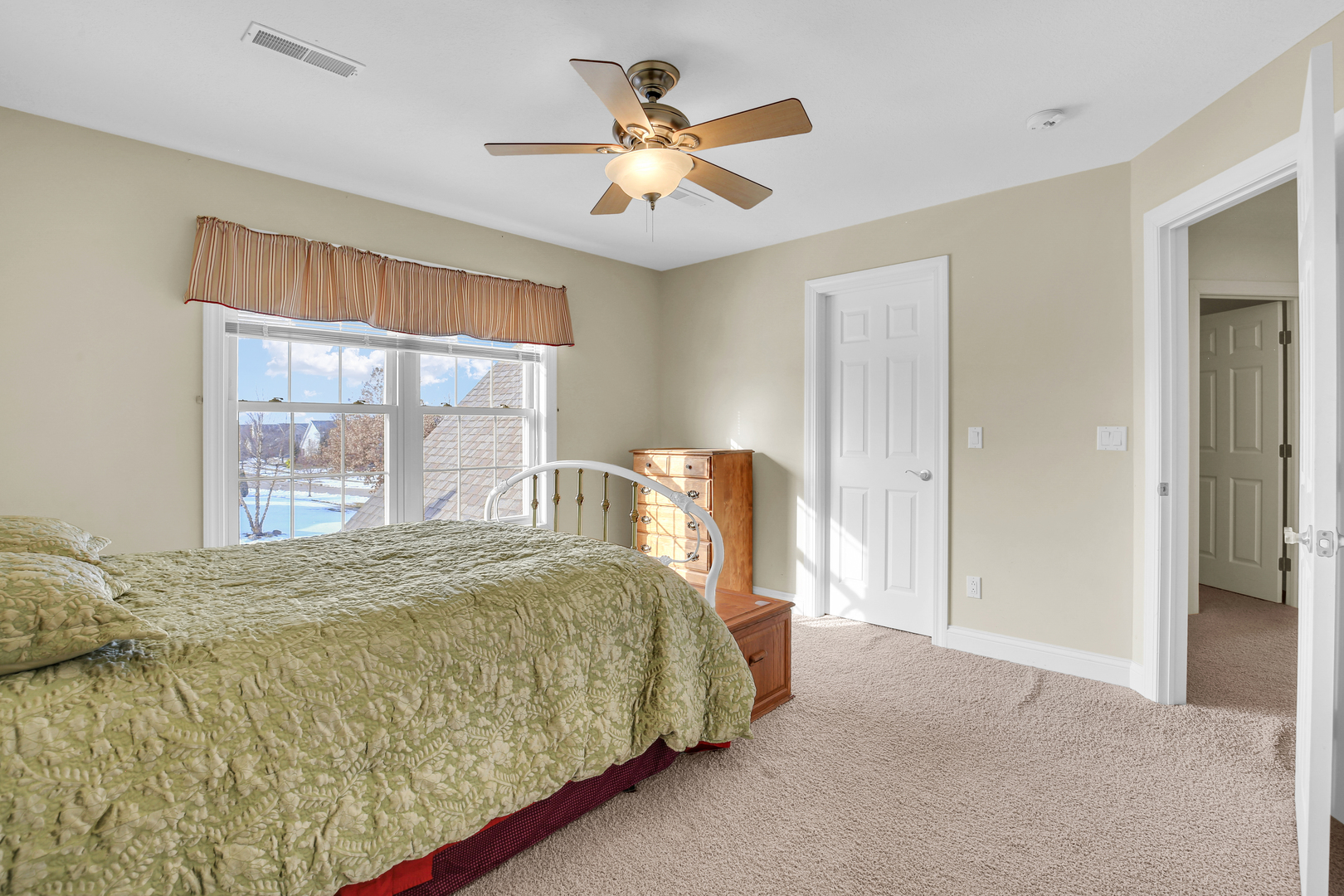 2202 Strand Drive Champaign, IL 61822 - Photo 49 of 62 a bedroom with a large bed and a large window