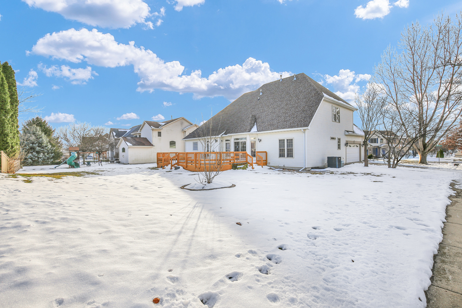2202 Strand Drive Champaign, IL 61822 - Photo 60 of 62 a view of large house with a yard covered in snow