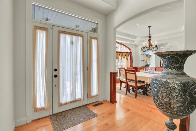 a view of a livingroom with furniture and chandelier