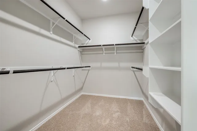 a view of an empty room with windows