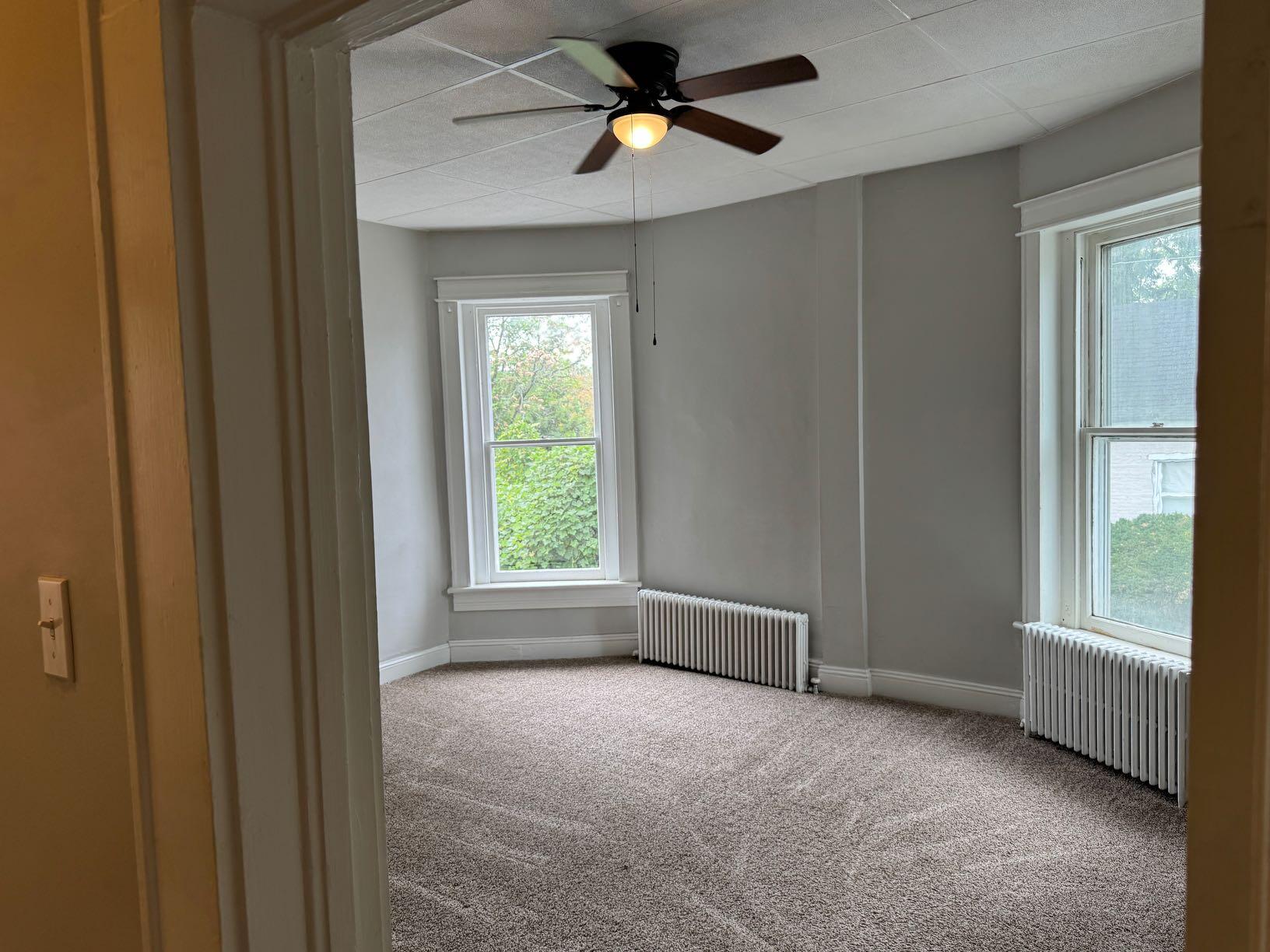 612 East Church Street, Unit 1 Martinsville, VA 24112 - Photo 2 of 6 a view of an empty room with a window