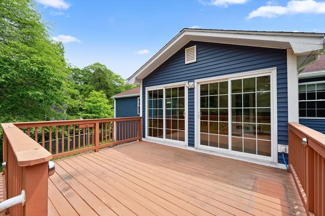a view of a deck with wooden floor and fence