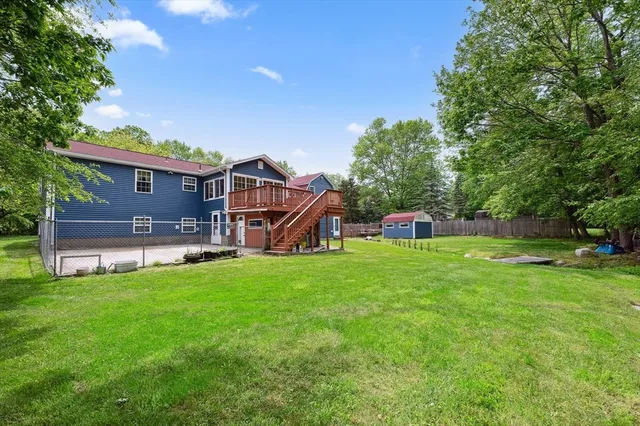 a house view with a sitting space and garden