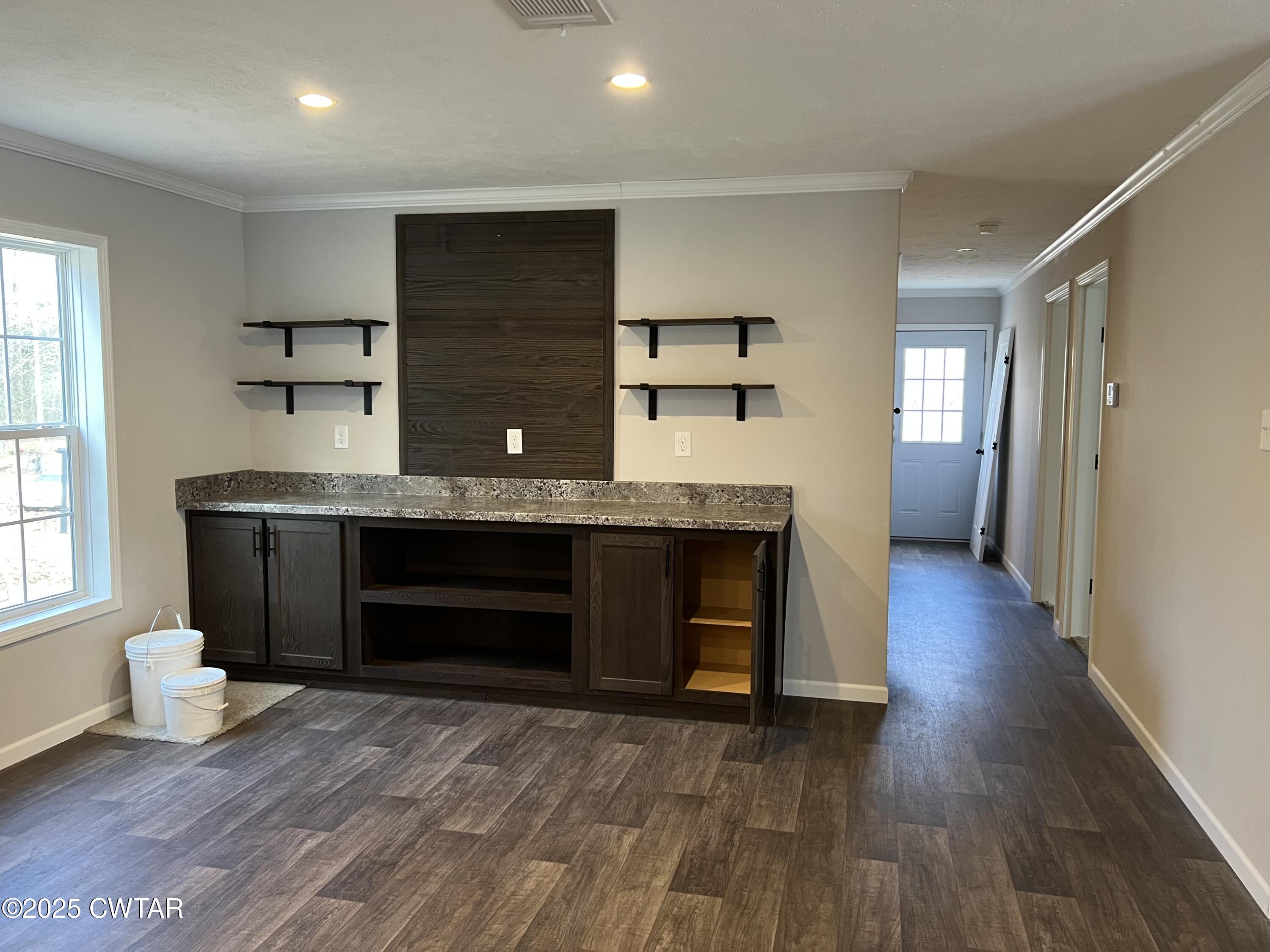 80 Simmons Road Pinson, TN 38366 - Photo 13 of 32 a kitchen with kitchen island a sink and a stove
