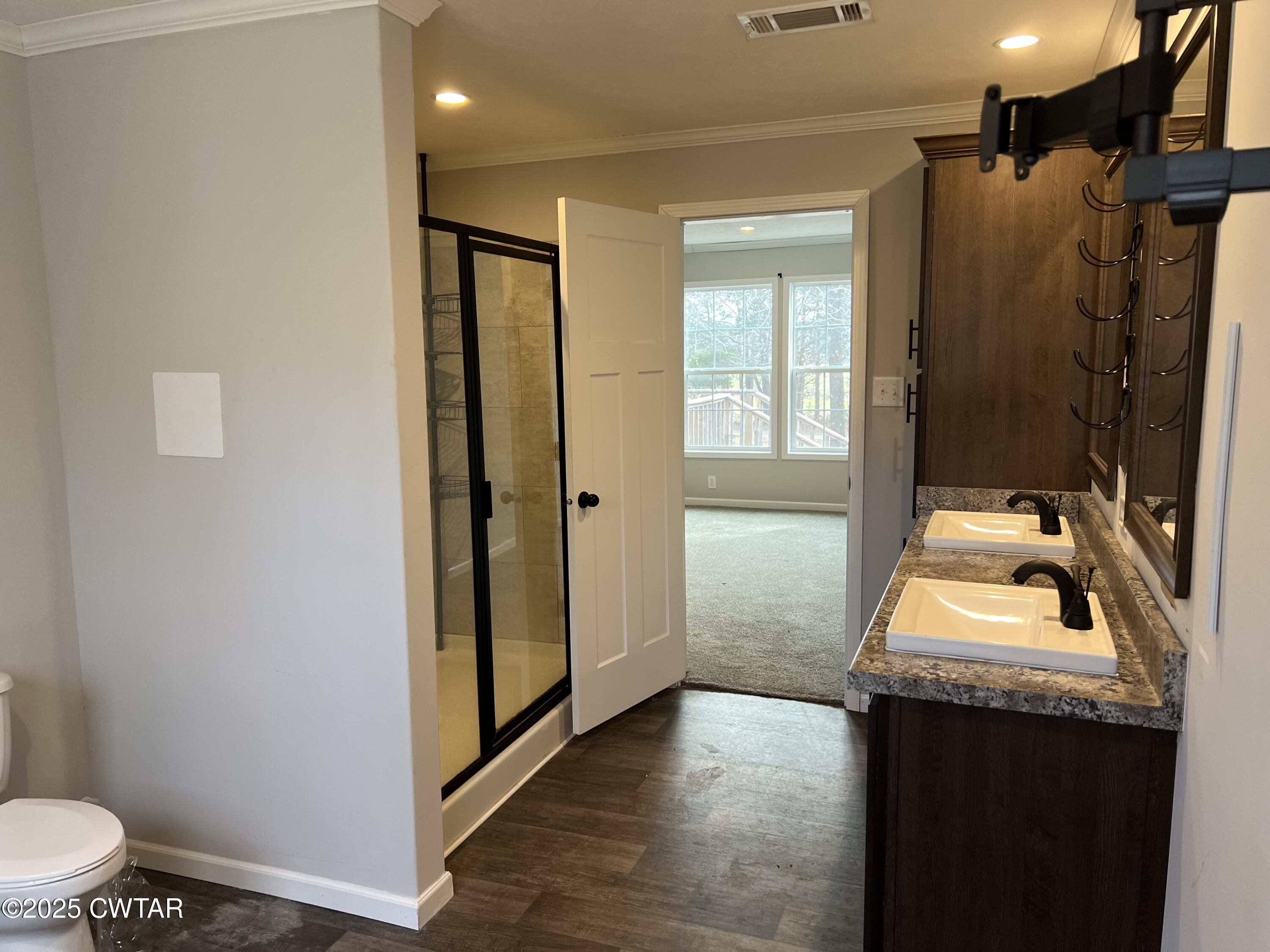 80 Simmons Road Pinson, TN 38366 - Photo 19 of 32 a bathroom with a sink and a mirror