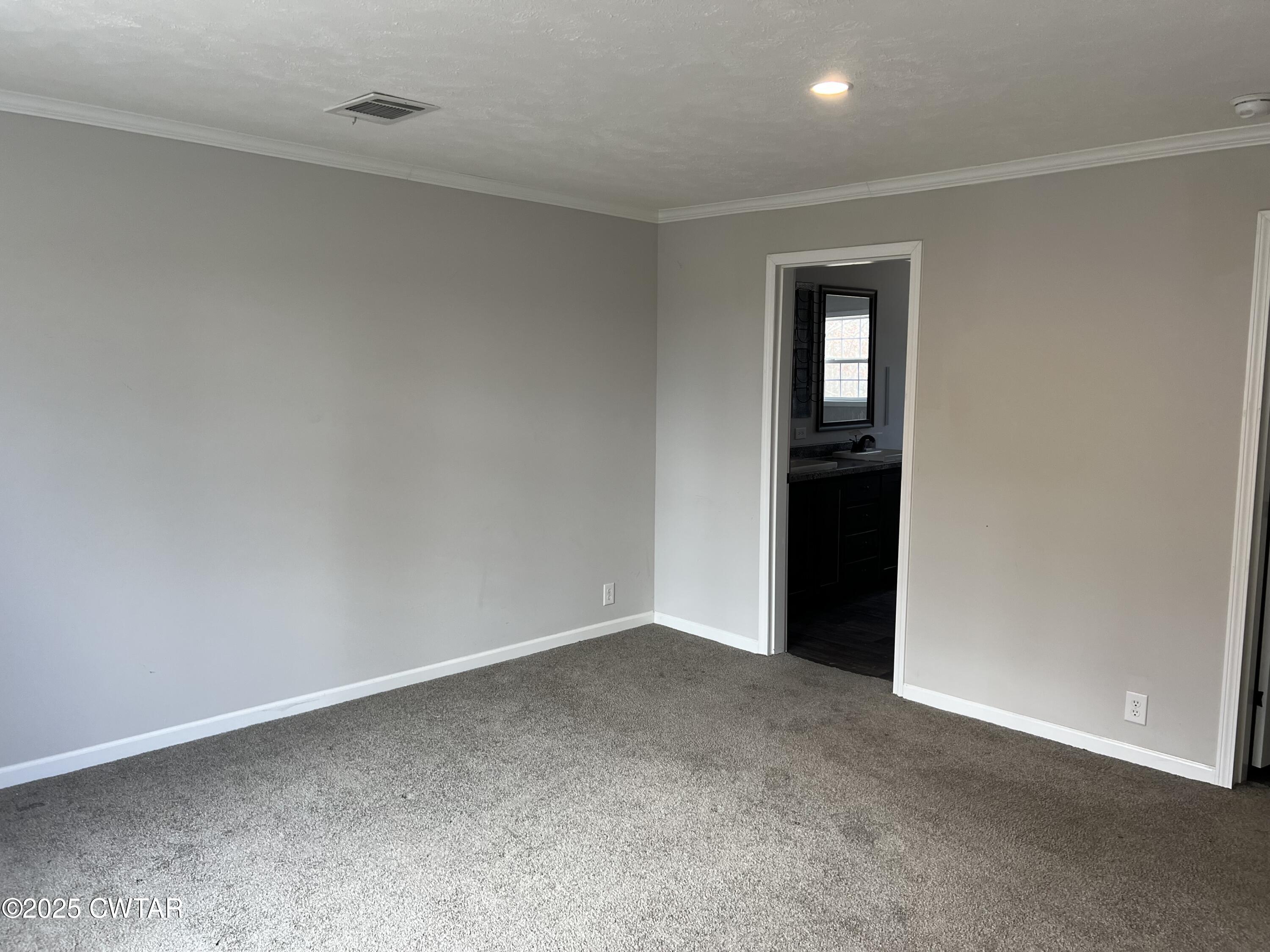 80 Simmons Road Pinson, TN 38366 - Photo 23 of 32 an empty room with closet area