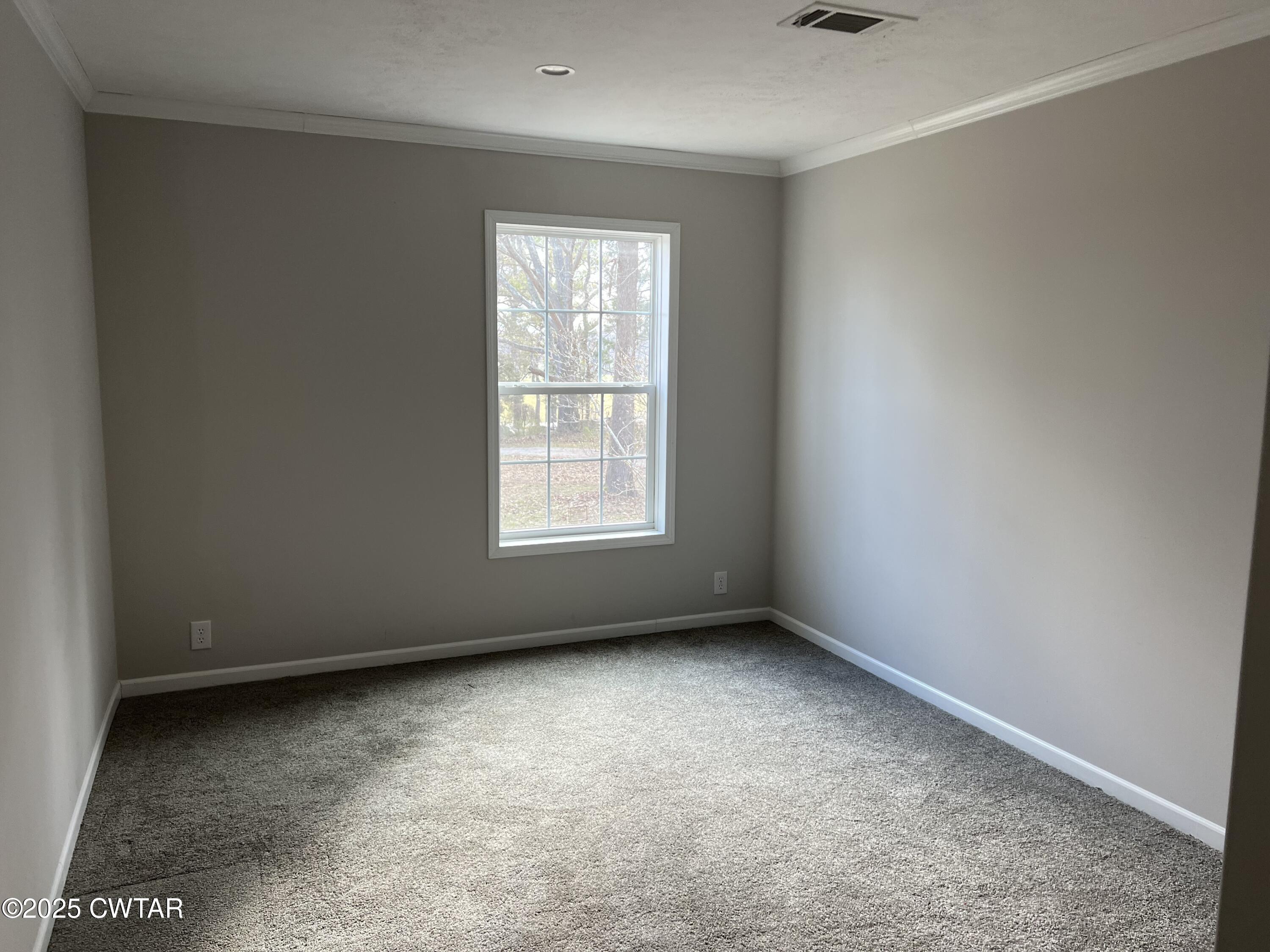 80 Simmons Road Pinson, TN 38366 - Photo 24 of 32 an empty room with a window