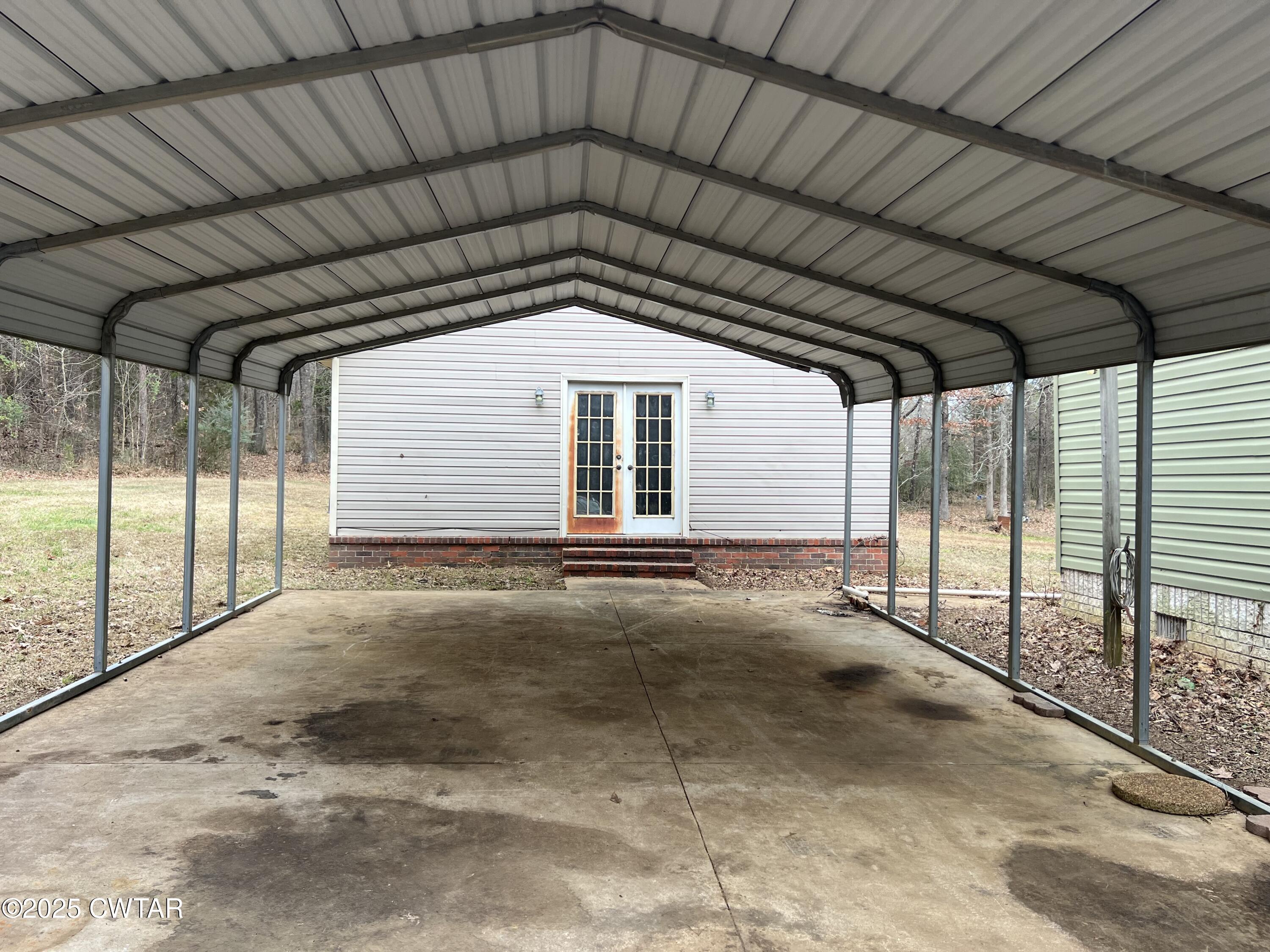 80 Simmons Road Pinson, TN 38366 - Photo 3 of 32 a view of a house with a garage
