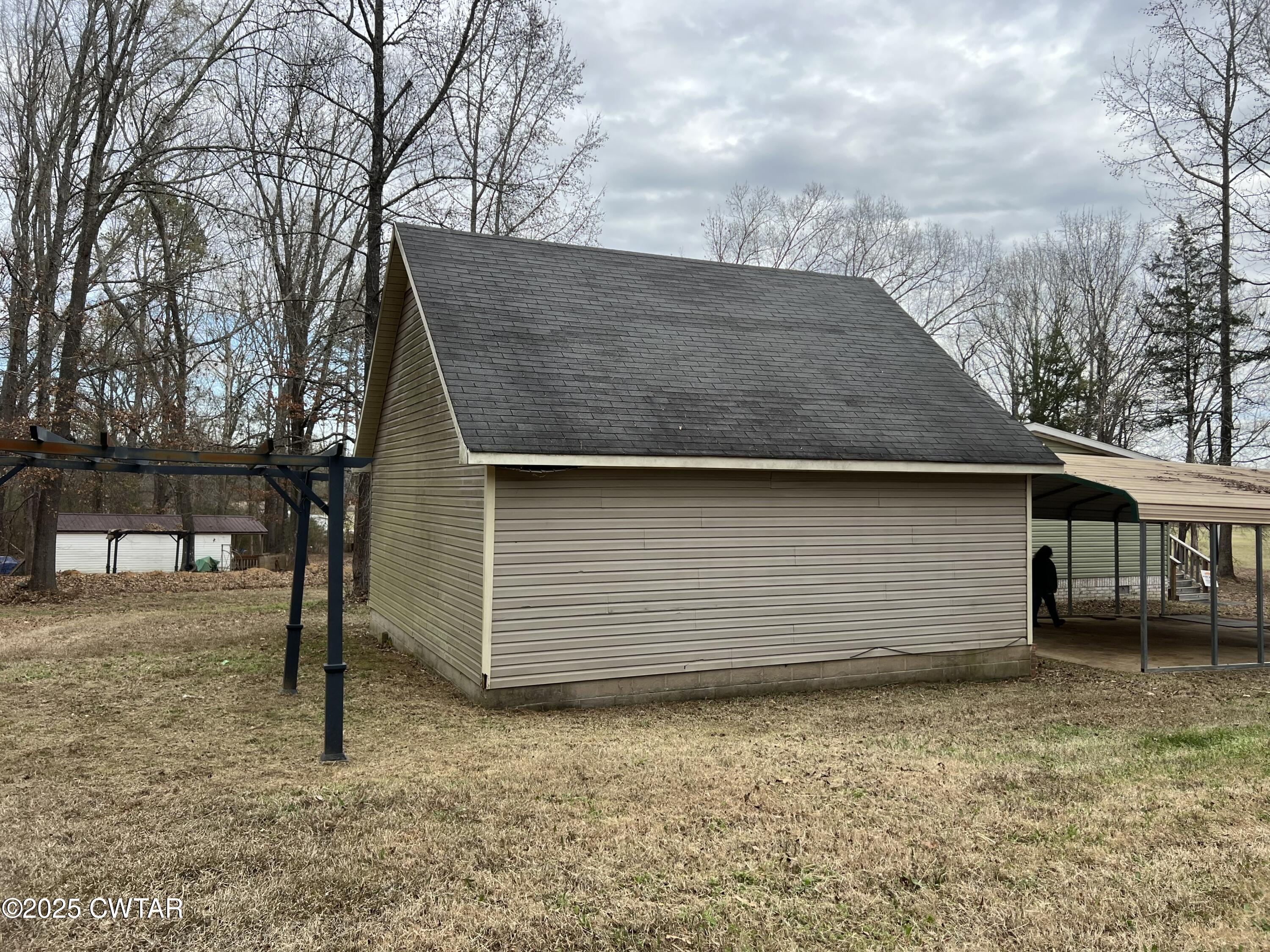 80 Simmons Road Pinson, TN 38366 - Photo 6 of 32 a backyard of a house