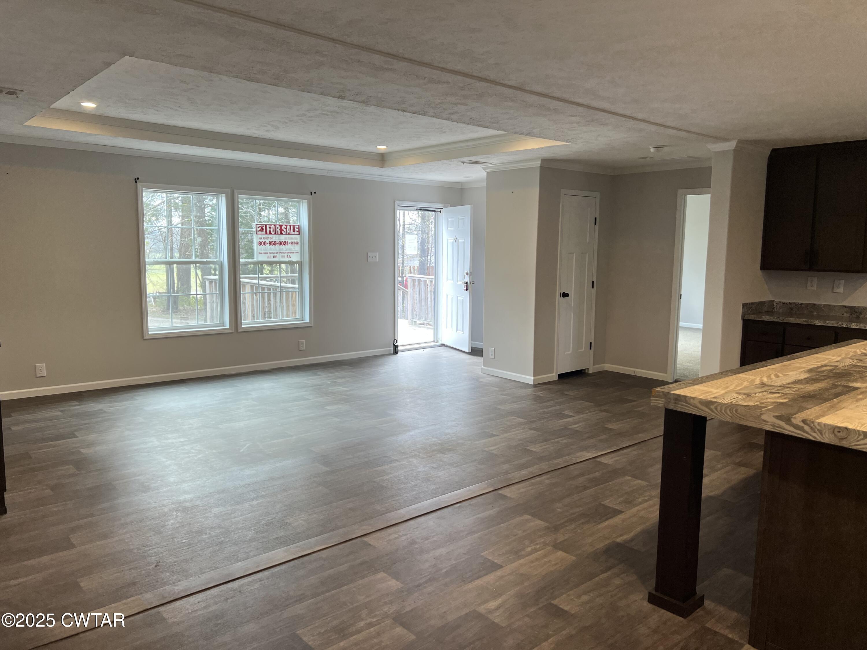 80 Simmons Road Pinson, TN 38366 - Photo 7 of 32 a view of a livingroom with an empty space and a window