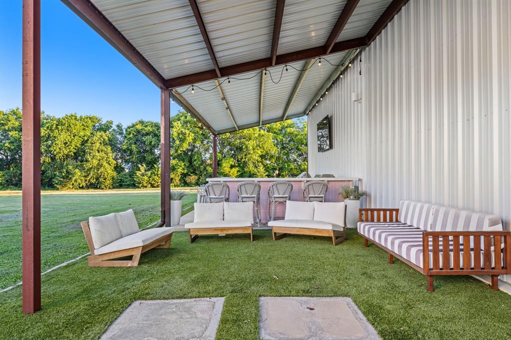 533 Camp Creek Road Rockwall, TX 75087 - Photo 32 of 40 a view of a backyard with wooden fence and a garden