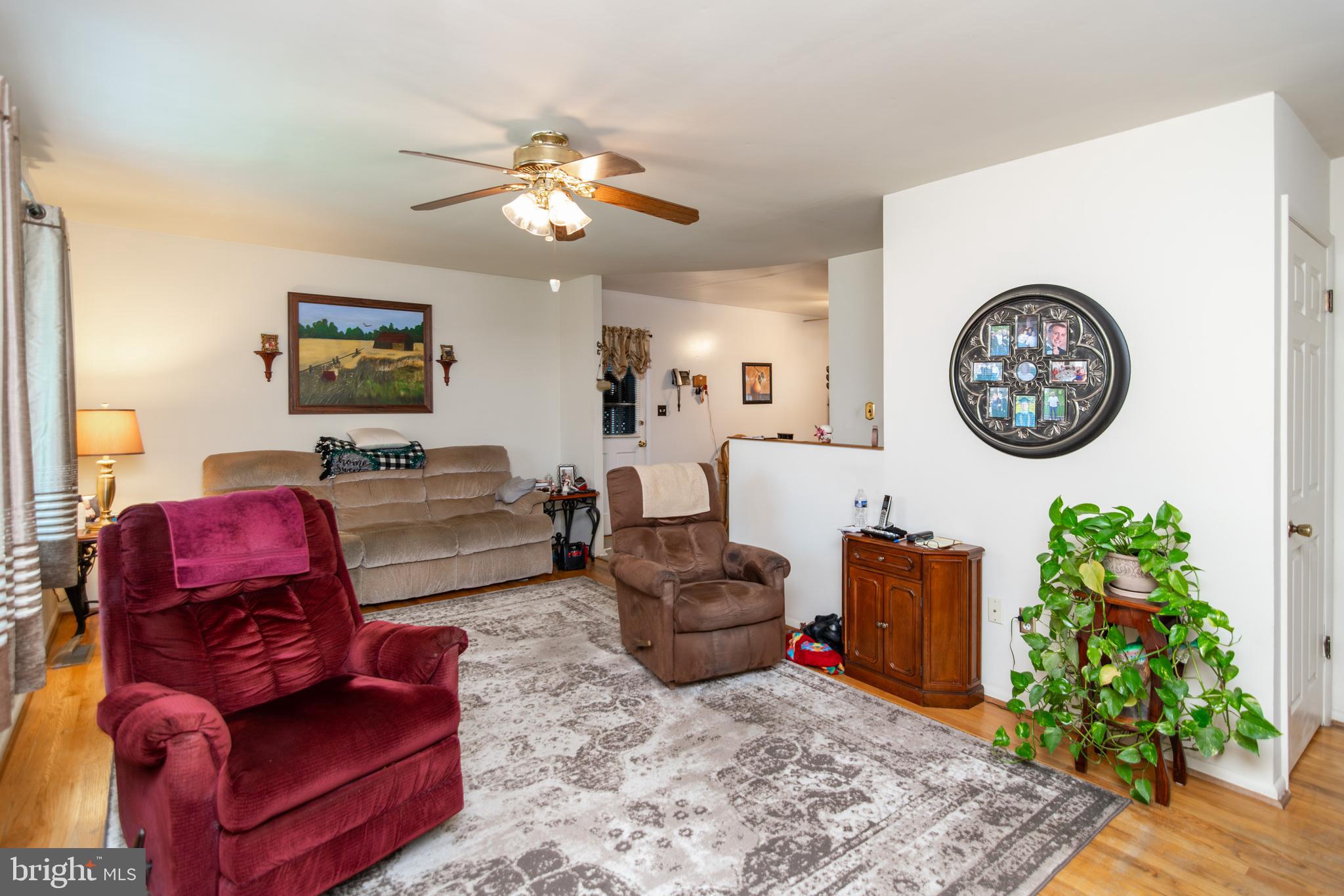 2014 Cherry Road Edgewood, MD 21040 - Photo 2 of 25 a living room with furniture a clock and a chandelier