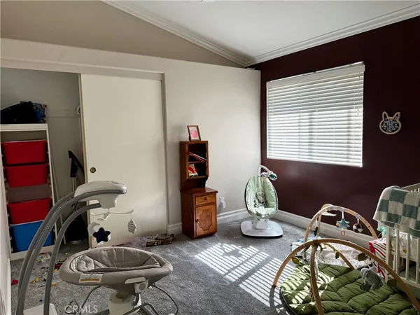 a bedroom with furniture toys and a window