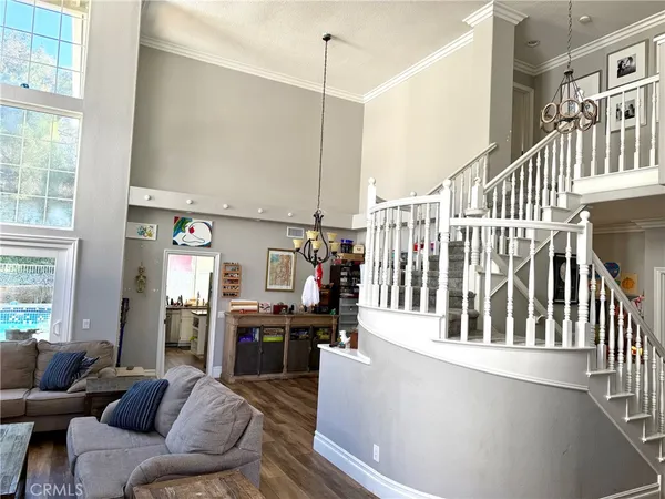 a living room with furniture and kitchen view