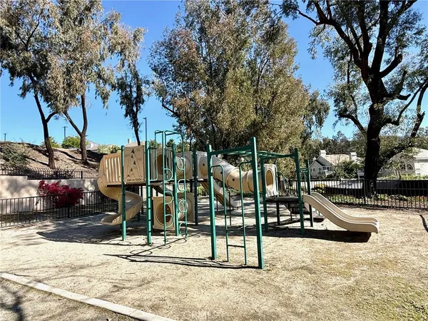 a view of outdoor space with garden and trees