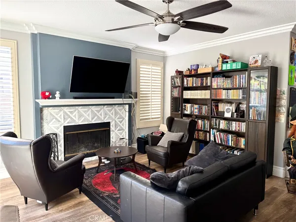 a living room with furniture fireplace and flat screen tv