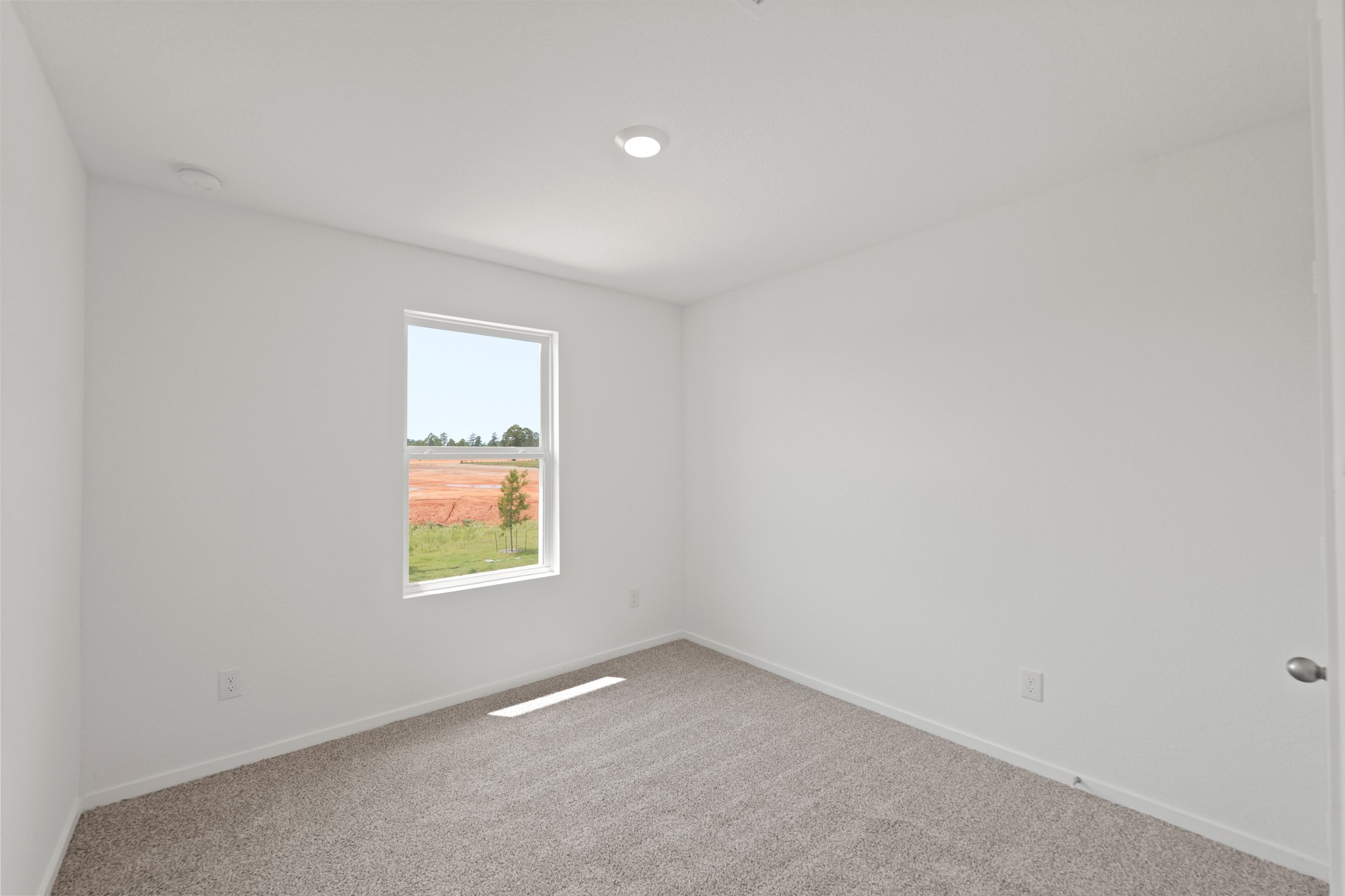 11759 Ruffian Drive Willis, TX 77318 - Photo 12 of 20 an empty room with a window