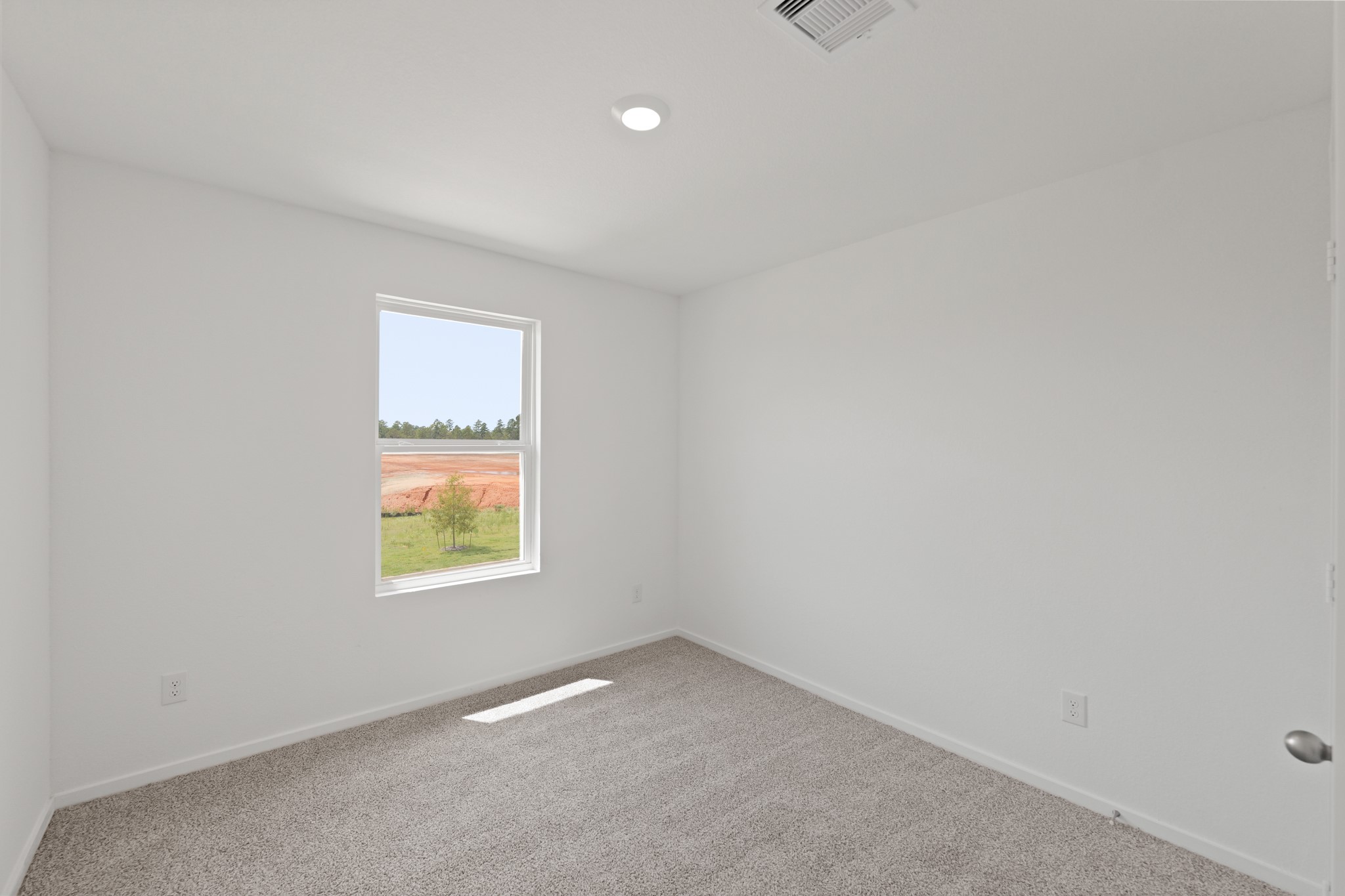 11759 Ruffian Drive Willis, TX 77318 - Photo 13 of 20 an empty room with a window