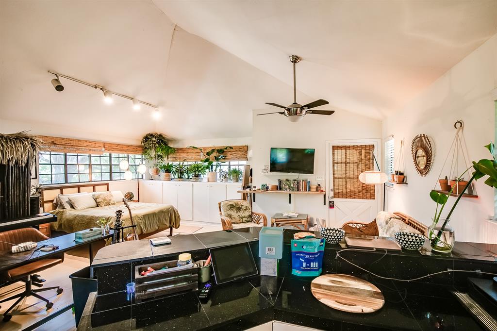 2400 Thornton Road, Unit A Austin, TX 78704 - Photo 7 of 13 Living room featuring lofted ceiling and ceiling fan