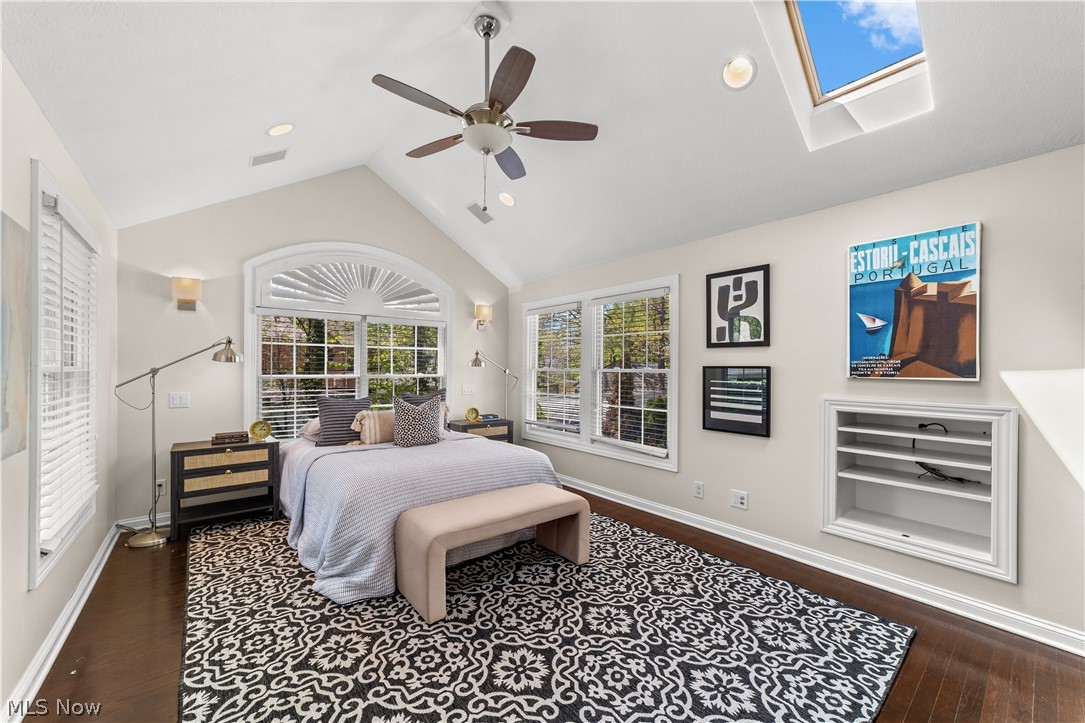 3806 Westwood Road University Heights, OH 44118 - Photo 15 of 41 Vaulted ceiling room featuring a skylight, ceiling fan, and wood-finish flooring