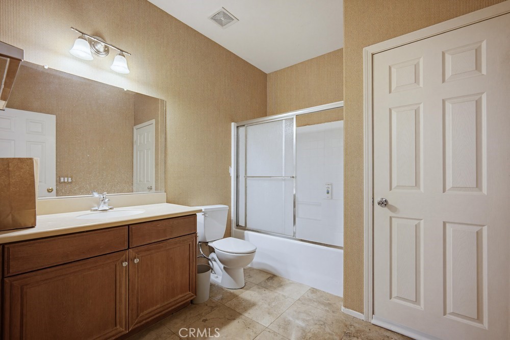 1747 Palermo Drive Riverside, CA 92507 - Photo 16 of 30 a spacious bathroom with a double vanity sink a mirror and a toilet