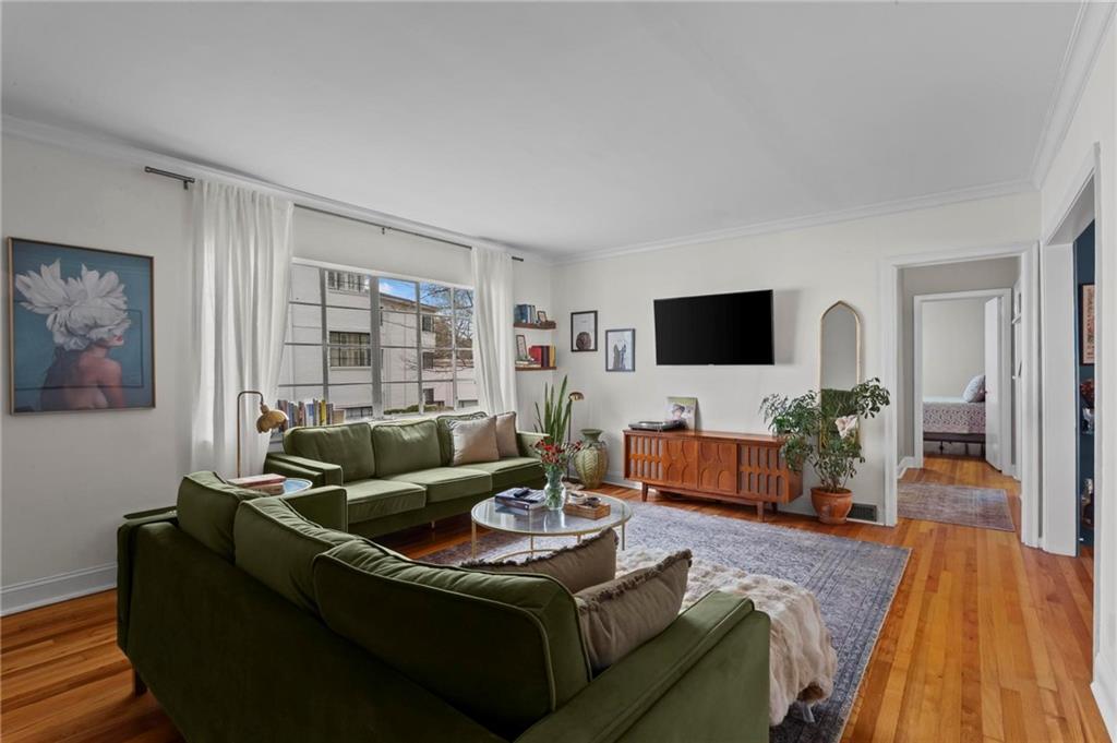 1120 Briarcliff Road Northeast, Unit 3 Atlanta, GA 30306 - Photo 11 of 29 a living room with furniture and a flat screen tv