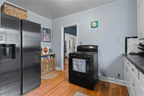 a kitchen with a stove and a refrigerator