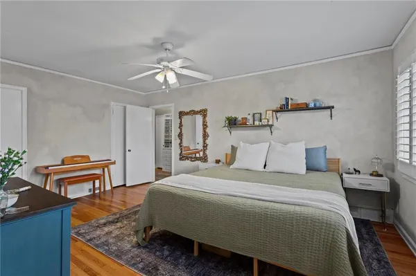 a bedroom with a bed and a piano