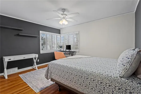 a bedroom with a bed and a table in it