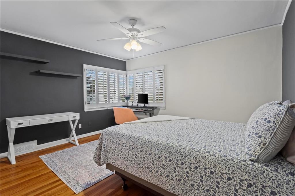 1120 Briarcliff Road Northeast, Unit 3 Atlanta, GA 30306 - Photo 20 of 29 a bedroom with a bed and a table in it