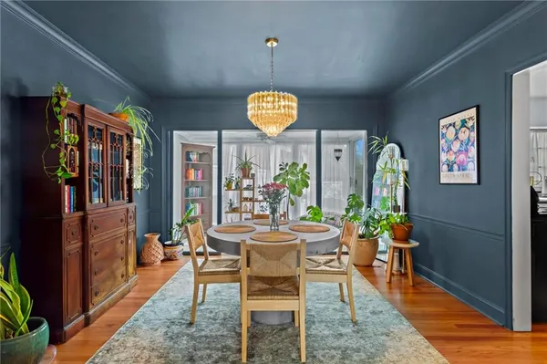 a dining room with furniture and window