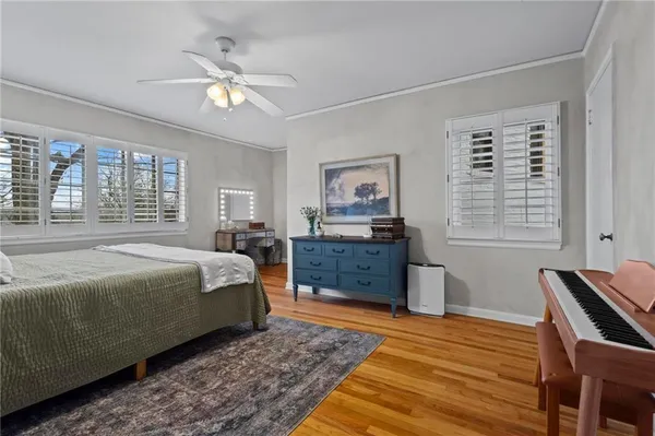 a bedroom with a bed and dresser