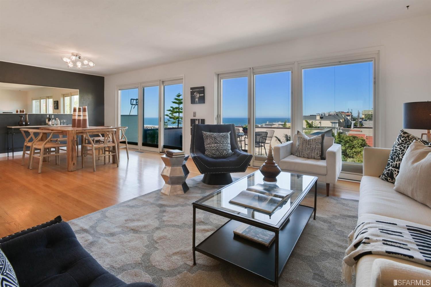 Living room / dining room with direct access to private patio and fabulous ocean views!