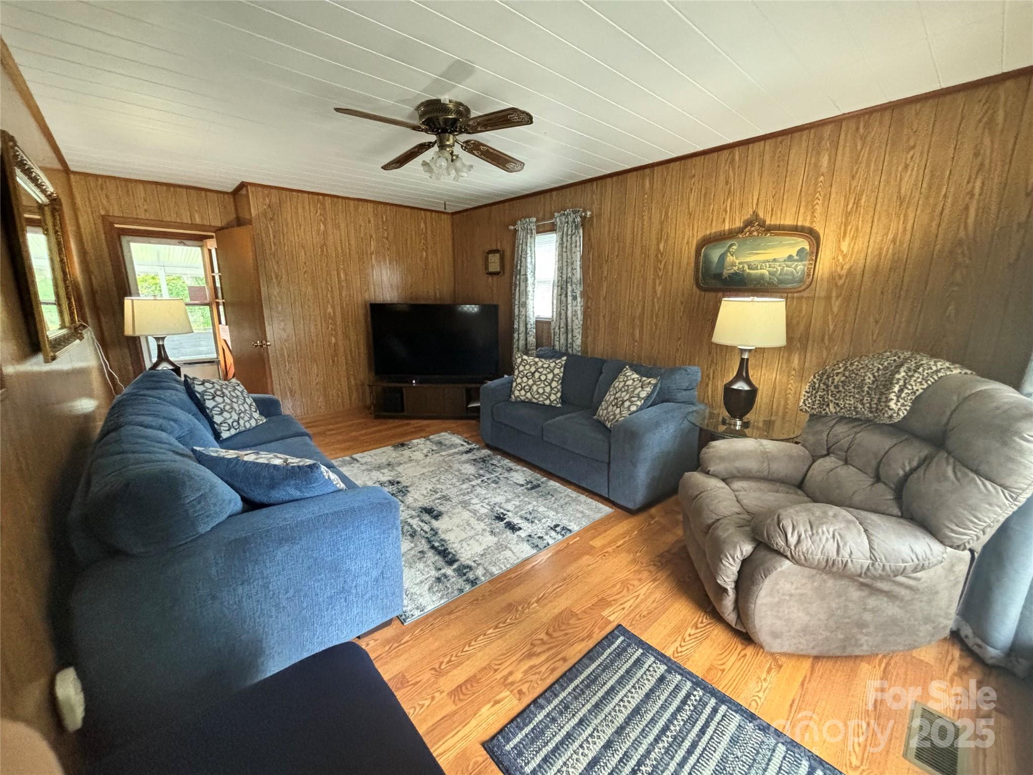 204 Cedar Hill Road Asheville, NC 28806 - Photo 16 of 25 a living room with furniture and a flat screen tv