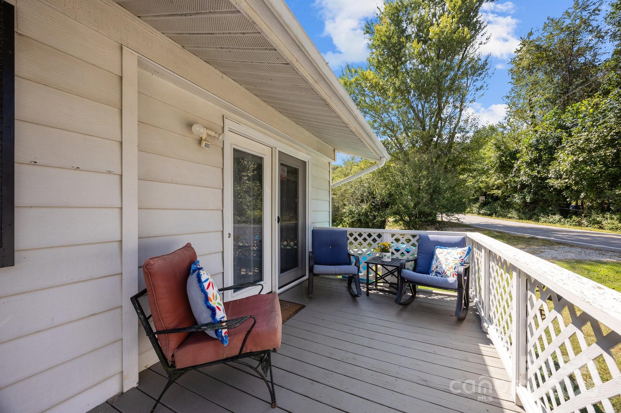 204 Cedar Hill Road Asheville, NC 28806 - Photo 22 of 25 a balcony with furniture and wooden floor