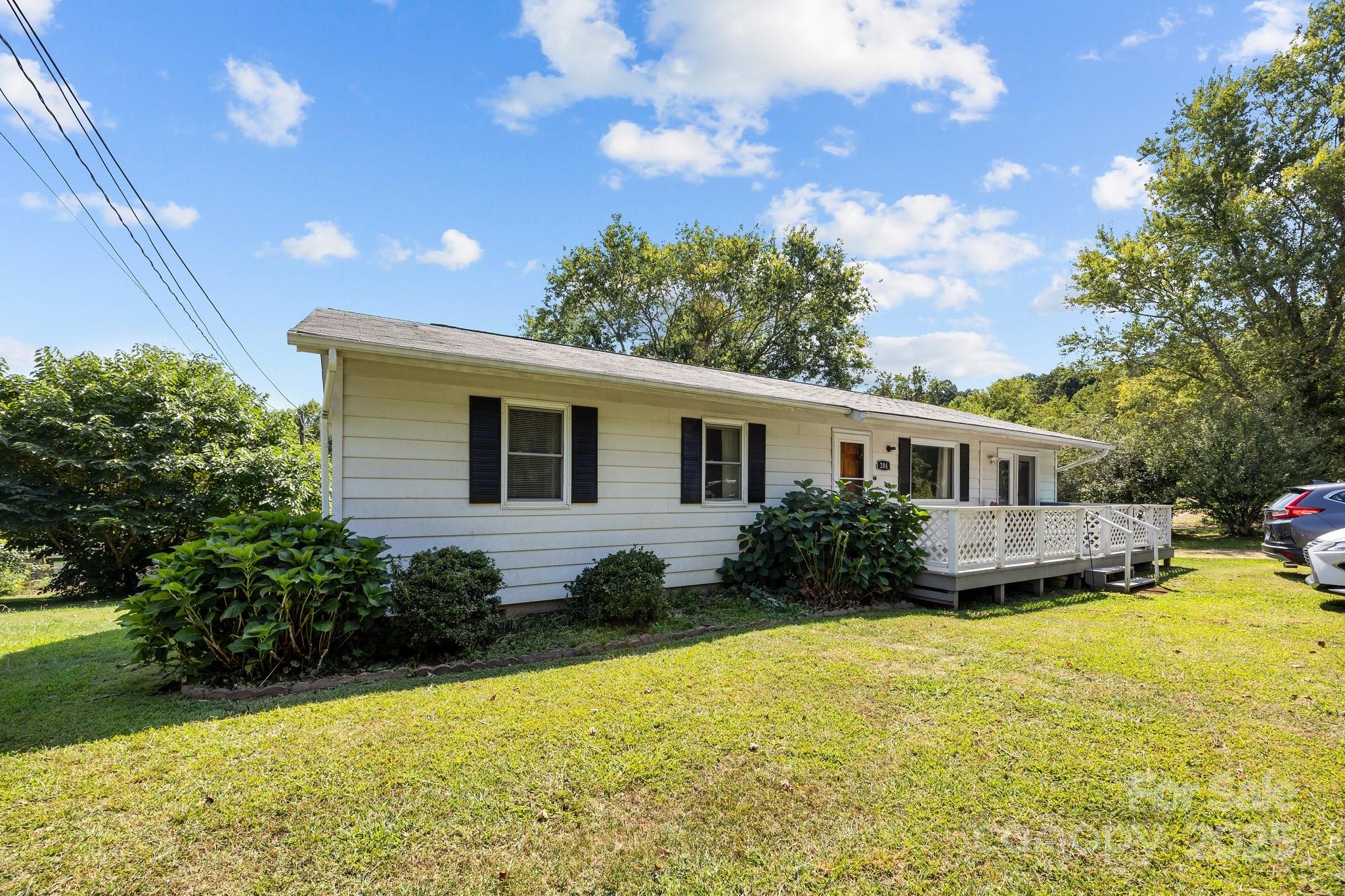 204 Cedar Hill Road Asheville, NC 28806 - Photo 23 of 25 a front view of a house with a garden