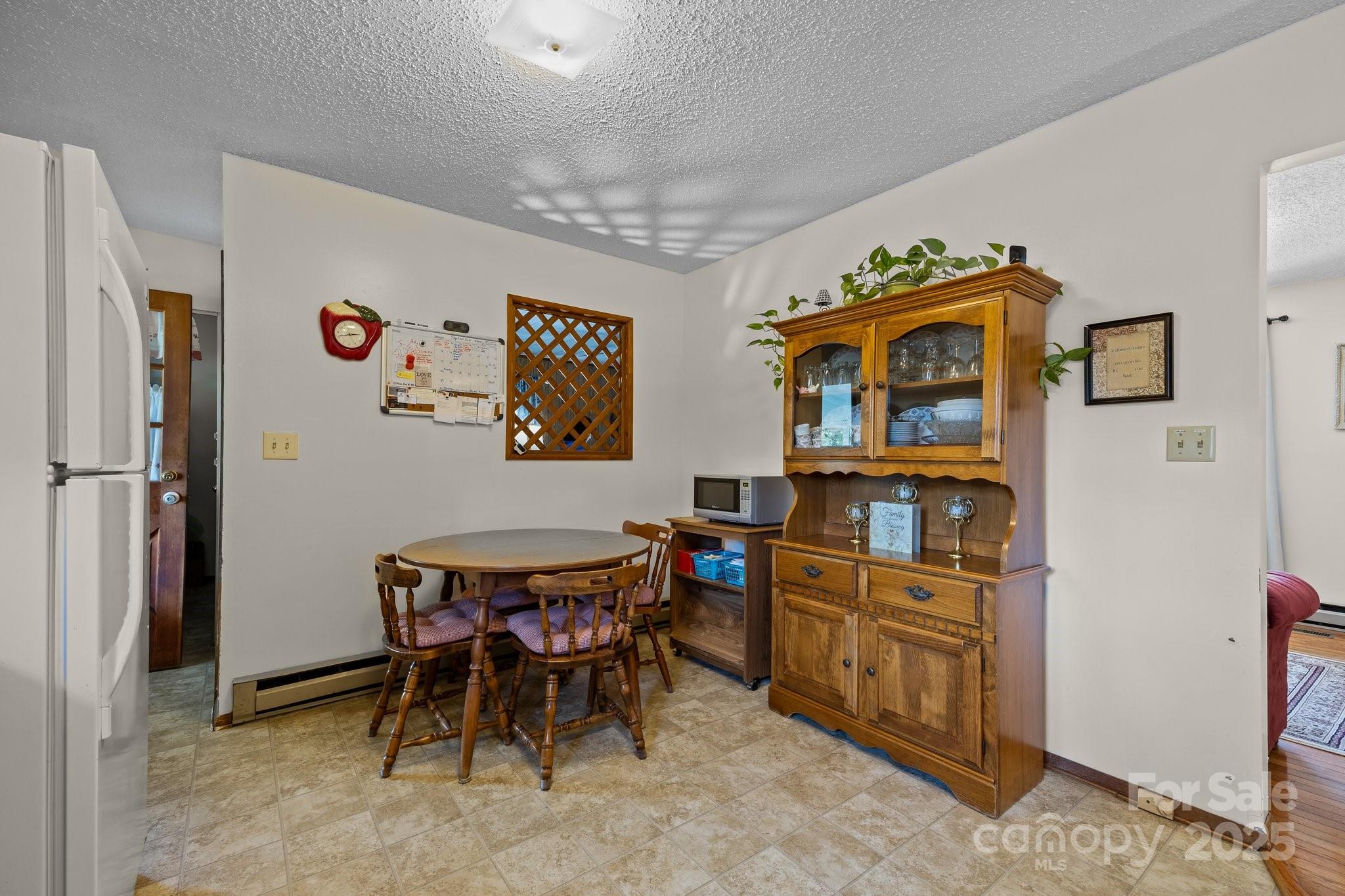204 Cedar Hill Road Asheville, NC 28806 - Photo 8 of 25 a dining room with furniture and window