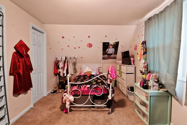 a bathroom with a granite countertop sink and a white toilet