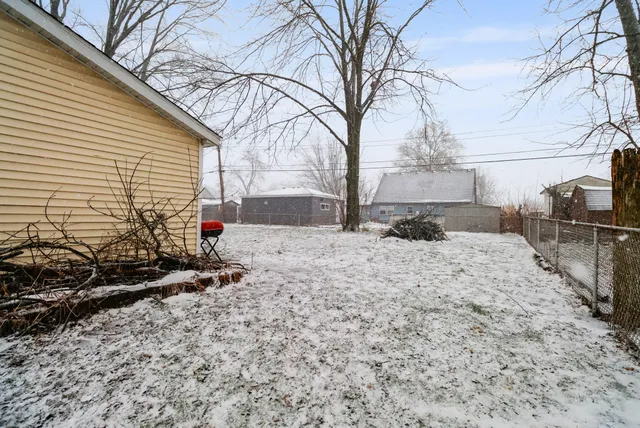a view of a backyard of the house