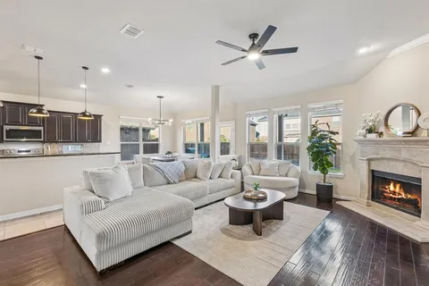 a living room with furniture and a fireplace
