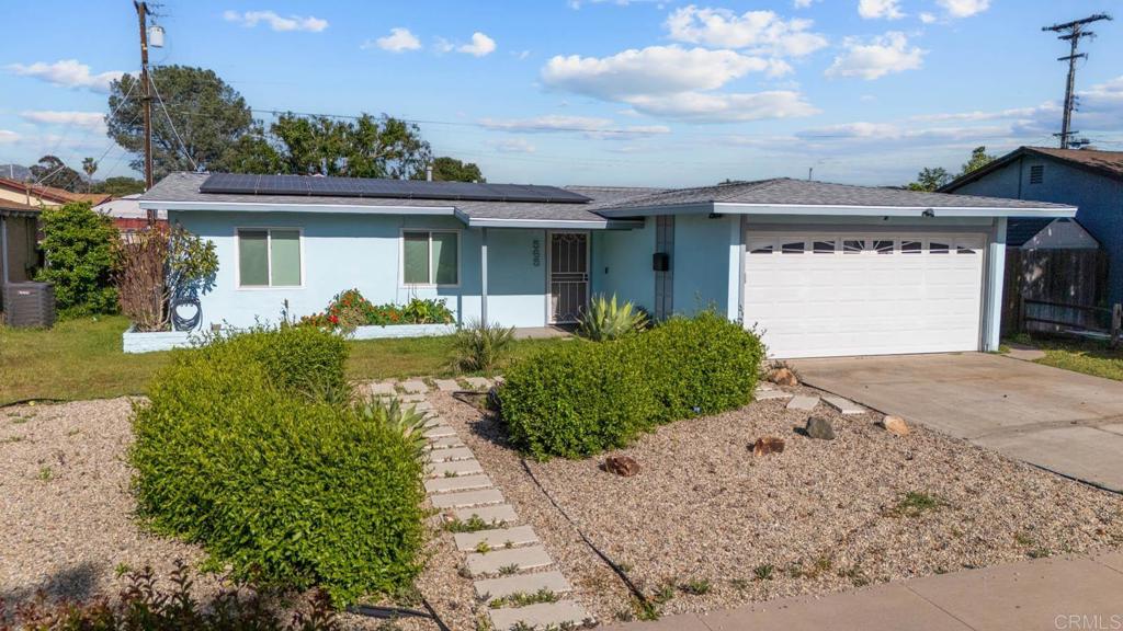 565 June Way El Cajon, CA 92021 - Photo 1 of 42 a front view of a house with a yard and potted plants