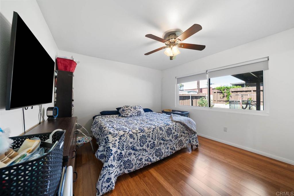 565 June Way El Cajon, CA 92021 - Photo 20 of 42 a bedroom with a bed and a flat screen tv