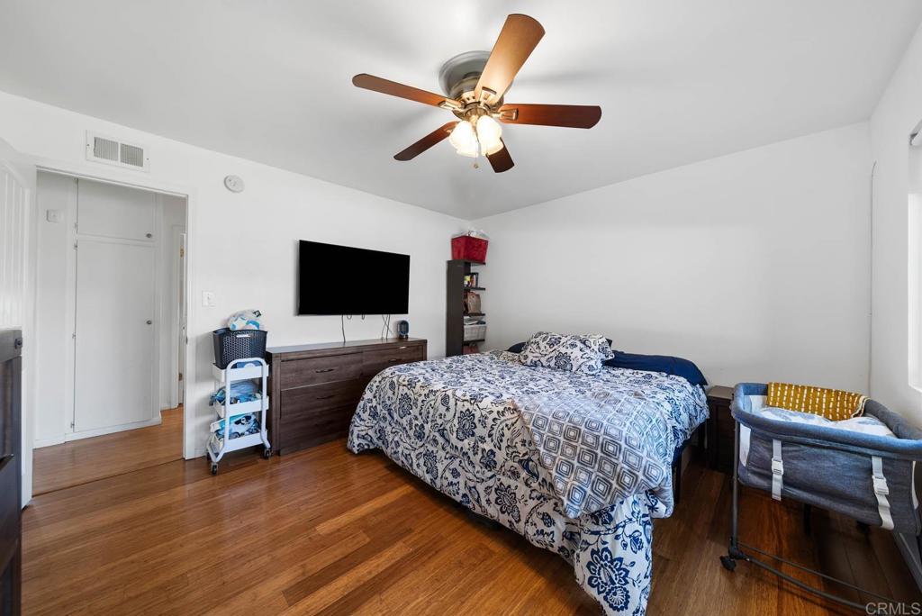 565 June Way El Cajon, CA 92021 - Photo 21 of 42 a bedroom with a bed and a flat screen tv
