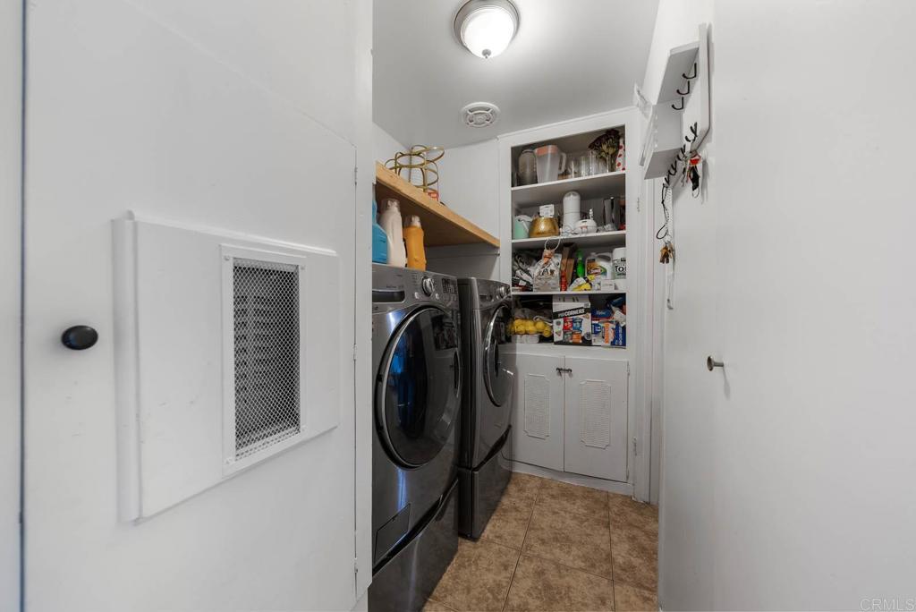 565 June Way El Cajon, CA 92021 - Photo 22 of 42 a view of a storage & utility room with washer and dryer