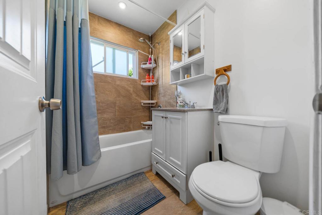 565 June Way El Cajon, CA 92021 - Photo 24 of 42 a white toilet sitting next to a bath tub