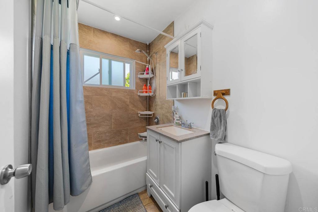 565 June Way El Cajon, CA 92021 - Photo 25 of 42 a bathroom with a sink toilet and shower