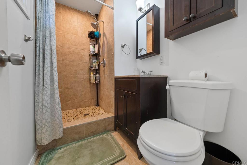 565 June Way El Cajon, CA 92021 - Photo 26 of 42 a white toilet sitting next to a bathroom sink