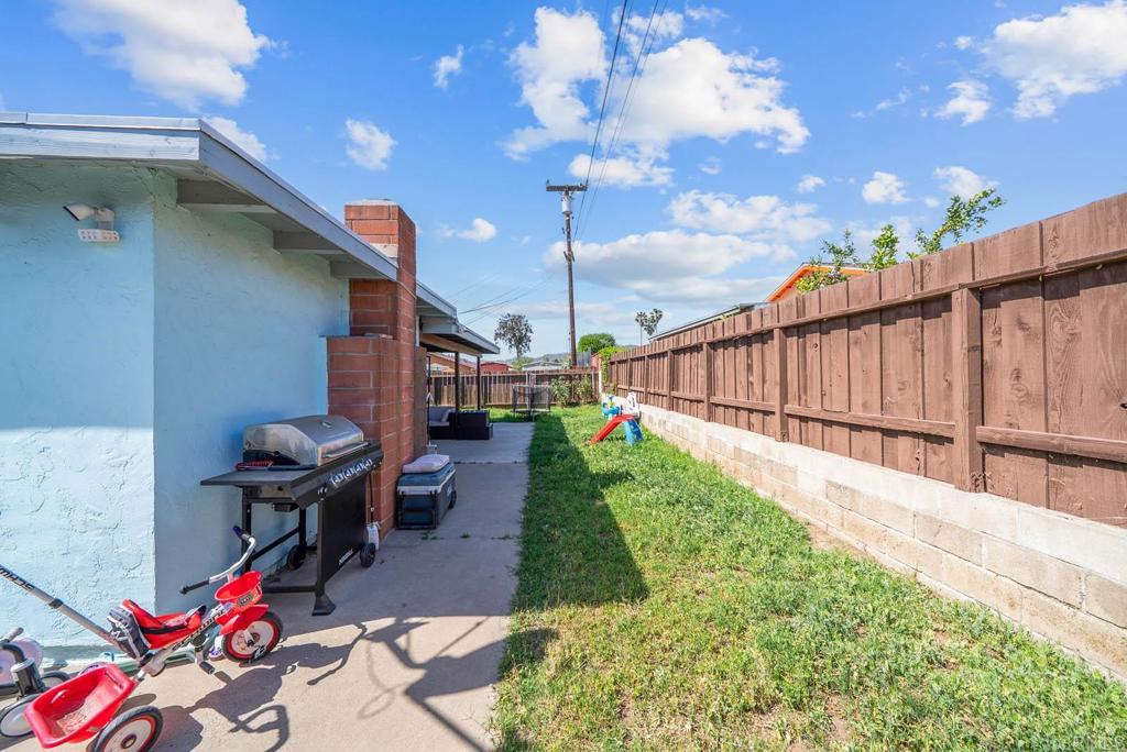 565 June Way El Cajon, CA 92021 - Photo 29 of 42 a view of a backyard with iron fence